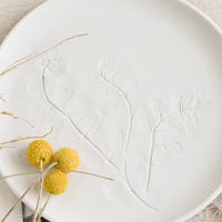 Medium / Porcelain White: A white porcelain plate with impression of mint leaves.