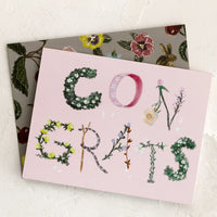 1: A pink congratulations card with botanical lettering.