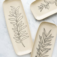 3: Tall and slender ceramic platters in natural bisque color with etched black botanical drawings