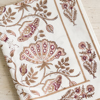 Rose Multi: A botanical block printed tablecloth in brown, pink and wine.