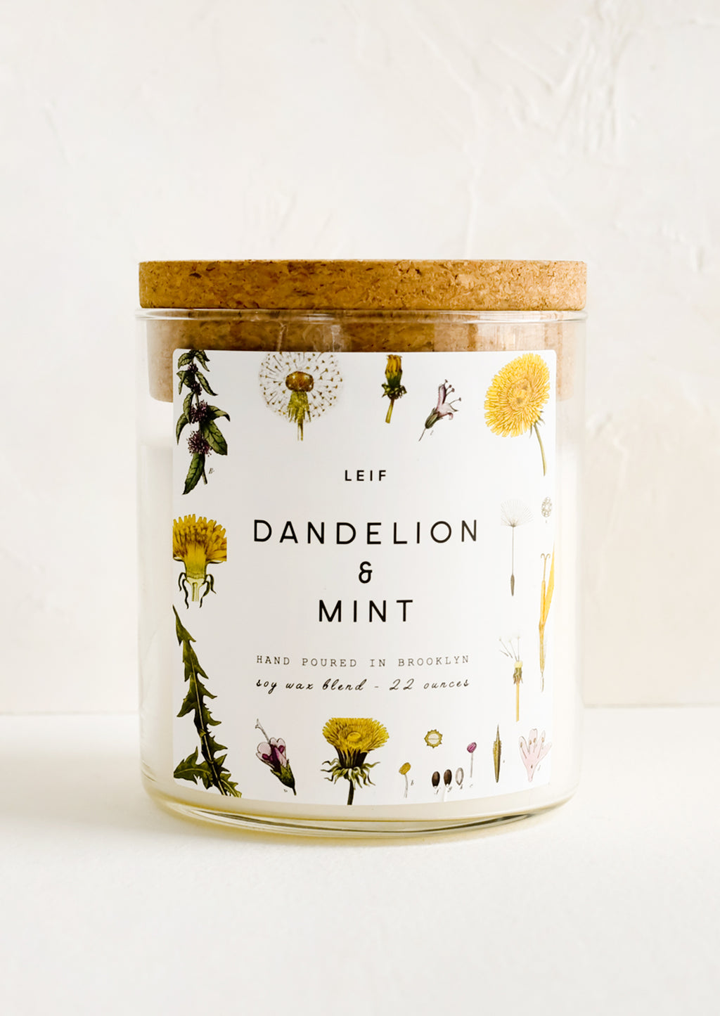 Dandelion & Mint: A glass jar candle in Dandelion & Mint scent with botanical print label.