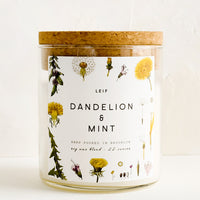 Dandelion & Mint: A glass jar candle in Dandelion & Mint scent with botanical print label.