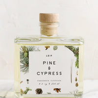 Pine & Cypress: A pine and cypress scented reed diffuser with glass bottle.
