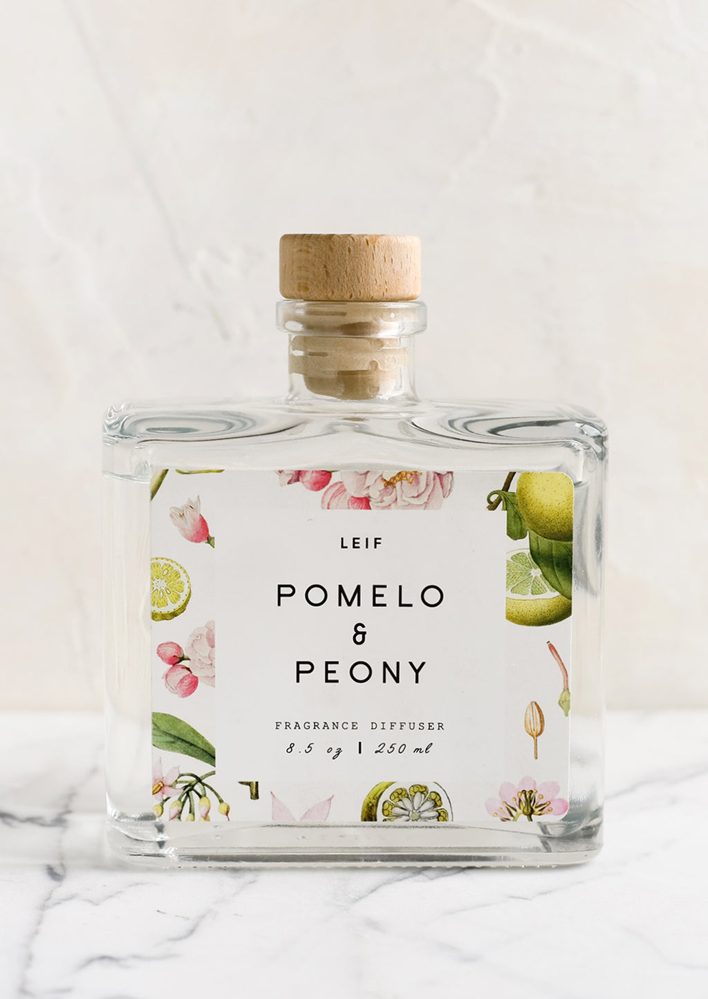 Pomelo & Peony: A pomelo and peony scented reed diffuser with glass bottle.