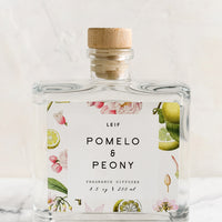 Pomelo & Peony: A pomelo and peony scented reed diffuser with glass bottle.