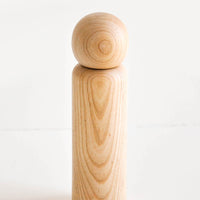 Light Ash: Minimal salt grinder in a light wood showing a curvy grain pattern.