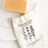Conifer & Herb: A printed muslin bag with a bar of soap.