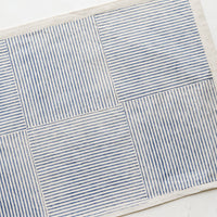 Natural / Indigo: Block printed cotton placemat with boxed stripe pattern in dusty blue.