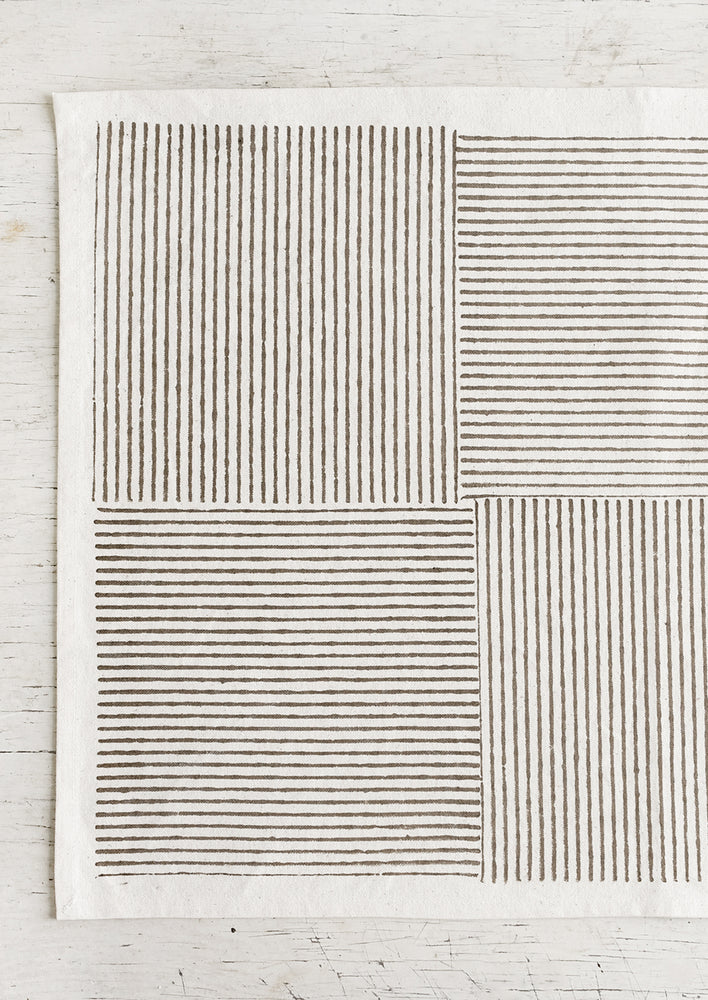 Block printed cotton placemats with boxed stripe pattern in khaki.