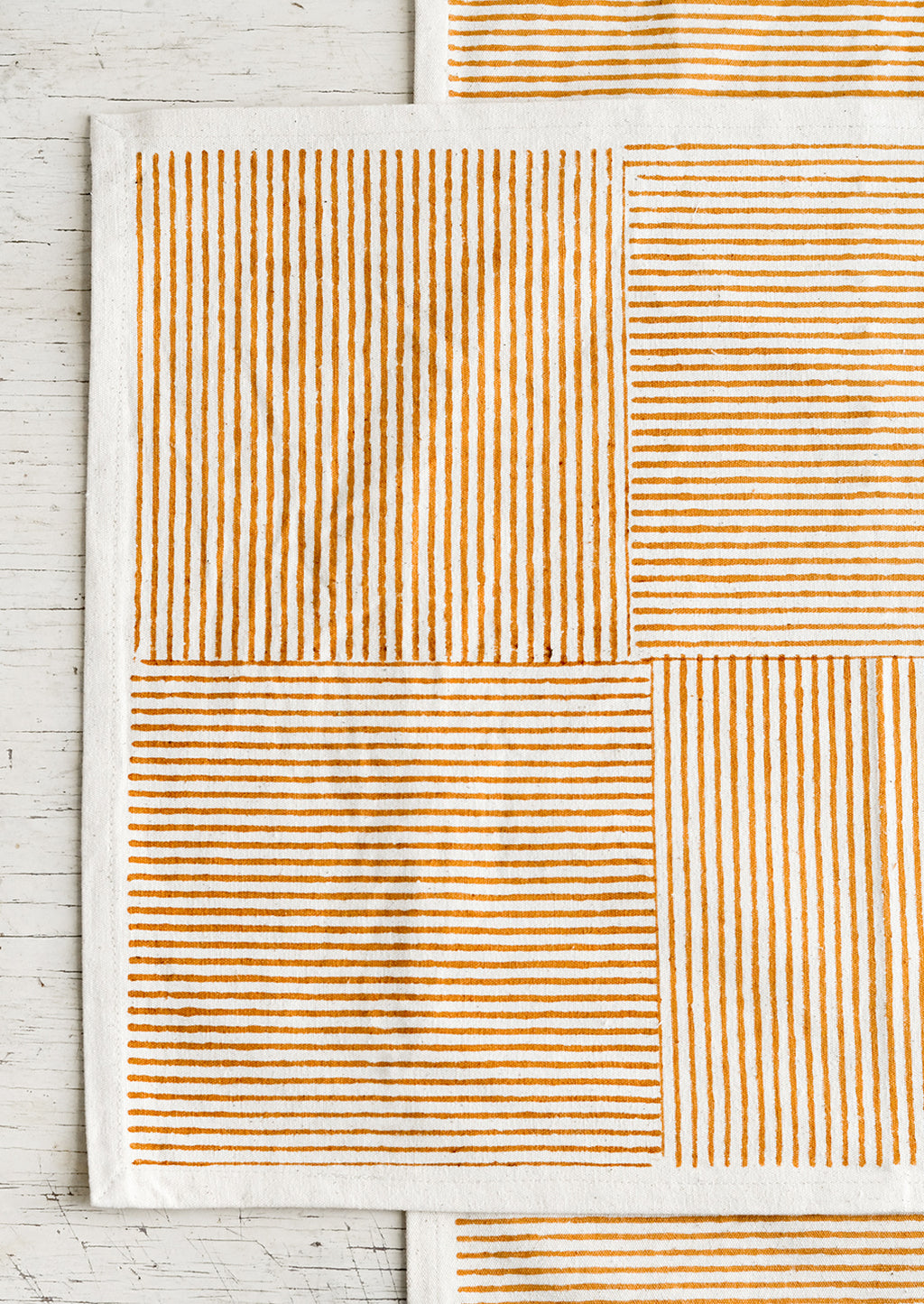 Natural / Ochre: Block printed cotton placemats with boxed stripe pattern in ochre.