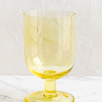 Lemon: A stemmed wine glass in yellow.