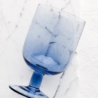 Twilight: A stemmed wine glass in twilight blue.