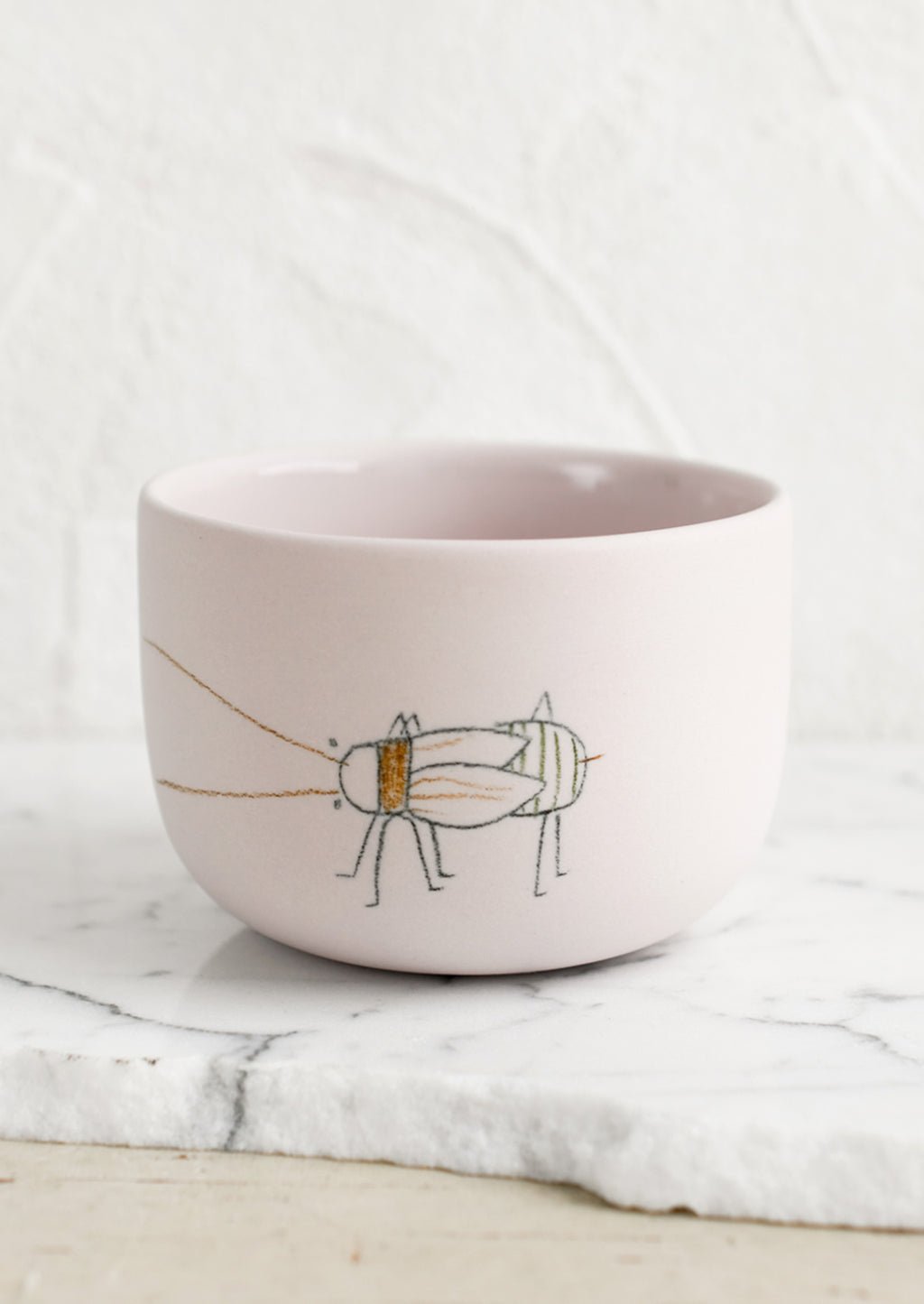 Medium / Beetle / Blush: A short and wide pink porcelain cup with beetle sketch.