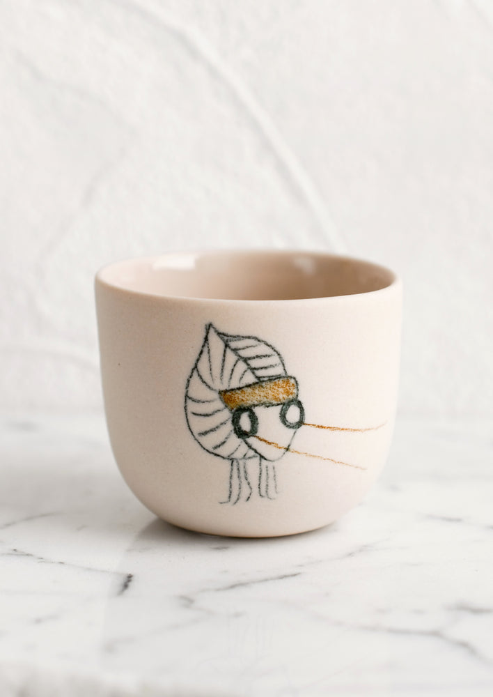 An extra small nude porcelain cup with katydid sketch.