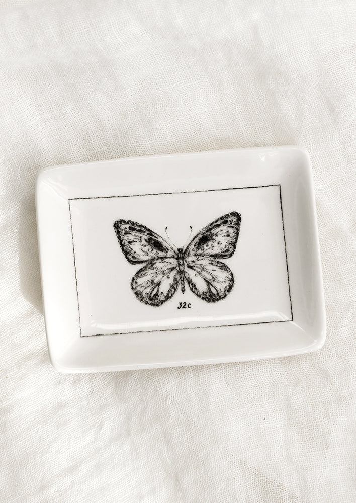 Butterfly: A black and white trinket dish with butterfly.