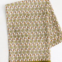 Olive Multi: A tea towel with olive green print and trim.