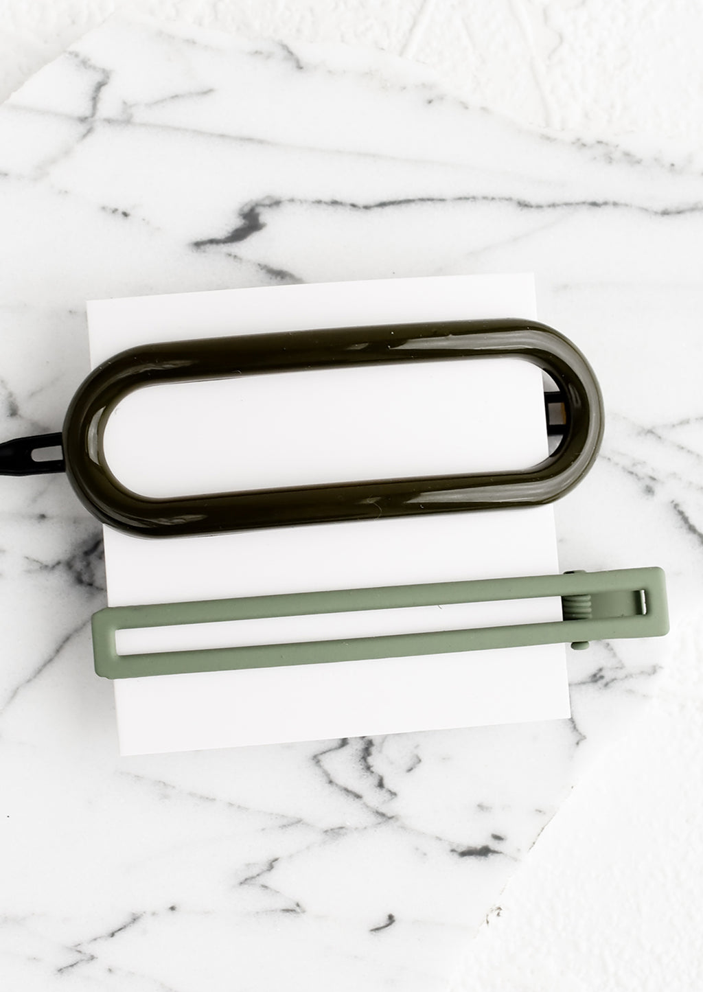 Forest Multi: A pair of hair clips in oval and rectangular shapes in shades of forest green.