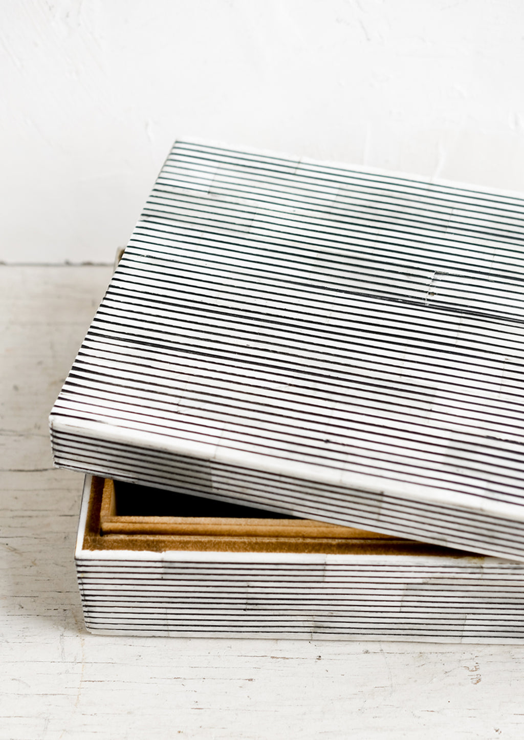 4: A large lidded storage box made from black & white striped bone.