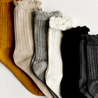 Black: Cotton socks in assorted colors.
