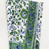 1: A set of two block printed napkins in blue and green floral print.