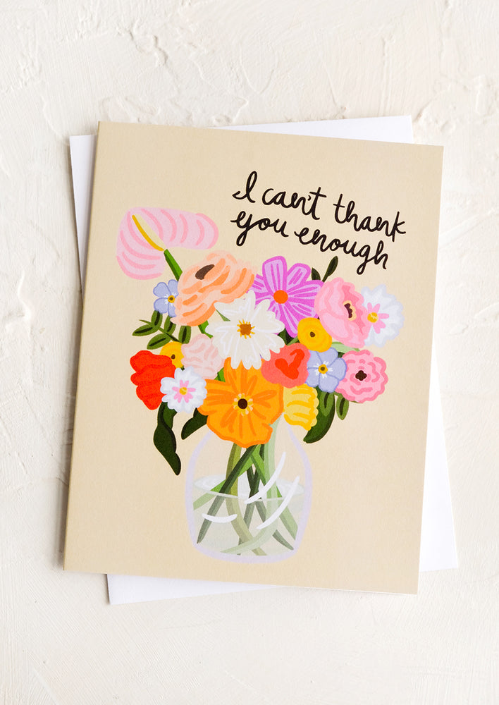1: A greeting card with bouquet of flowers in a vase with text reading "I can't thank you enough".