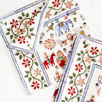 2: Pair of cotton dinner napkins in white with multicolor carnival print