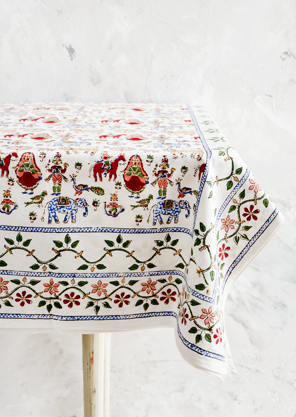 2: White cotton tablecloth with multicolor, block printed folk carnival themed print