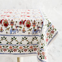 2: White cotton tablecloth with multicolor, block printed folk carnival themed print