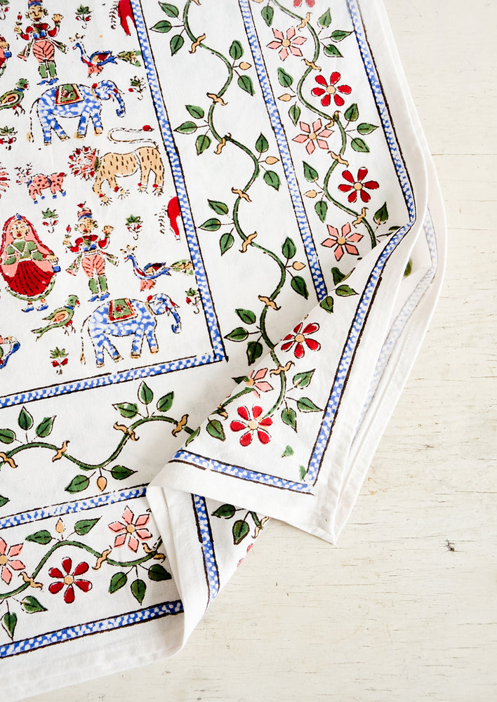 1: White cotton tablecloth with multicolor, block printed folk carnival themed print