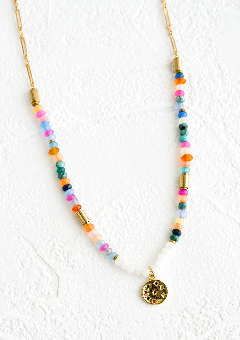 1: A necklace made of colorful rondelle beads with gold accents.