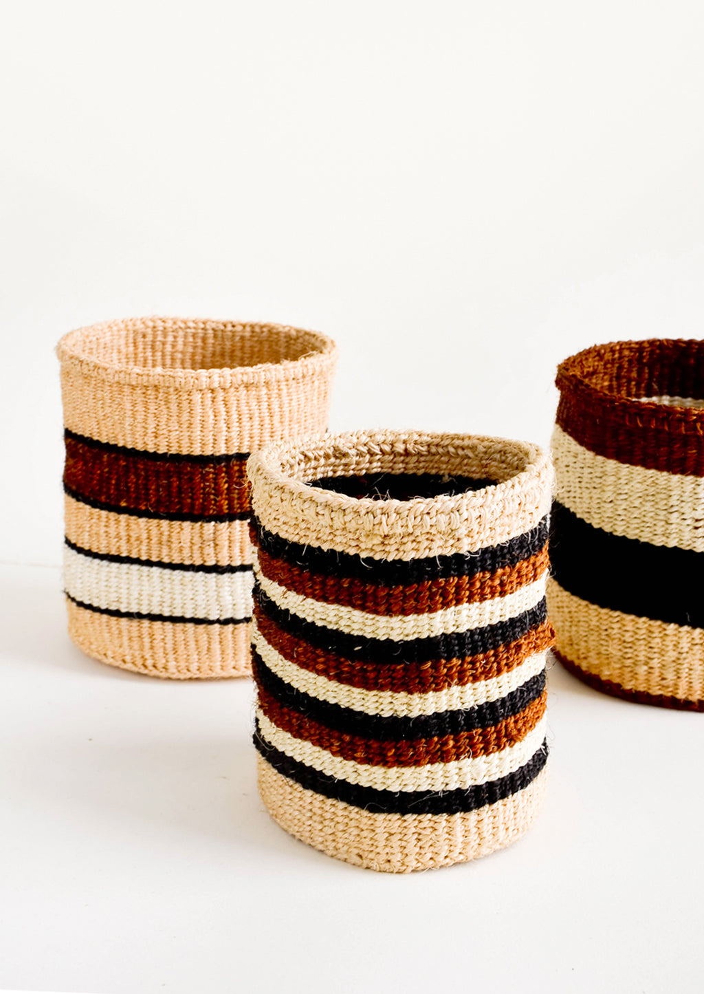 2: Small, round storage baskets in an assortment of striped patterns