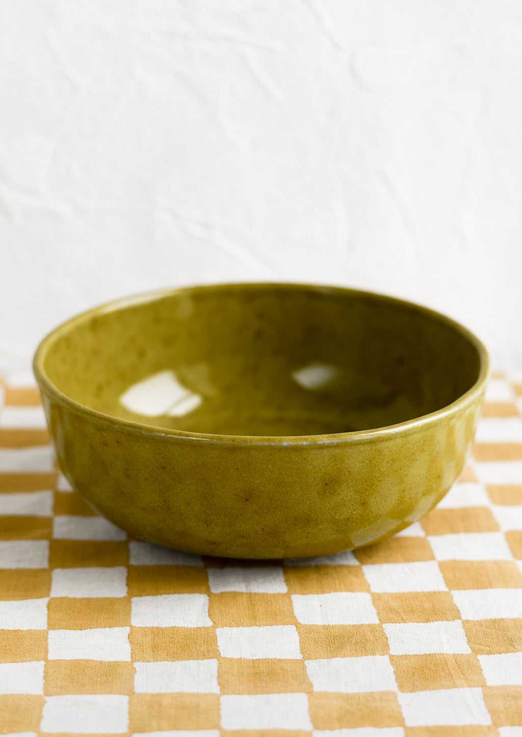 Serving Bowl: A large ceramic serving bowl in mossy green glaze.