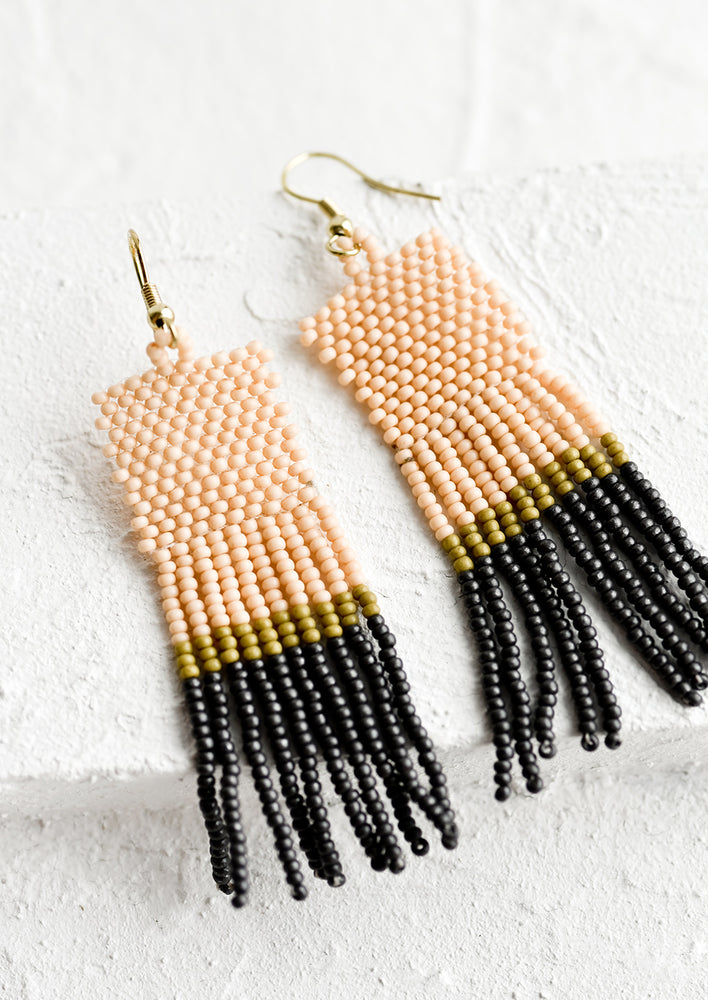 1: A color blocked pair of beaded earrings.