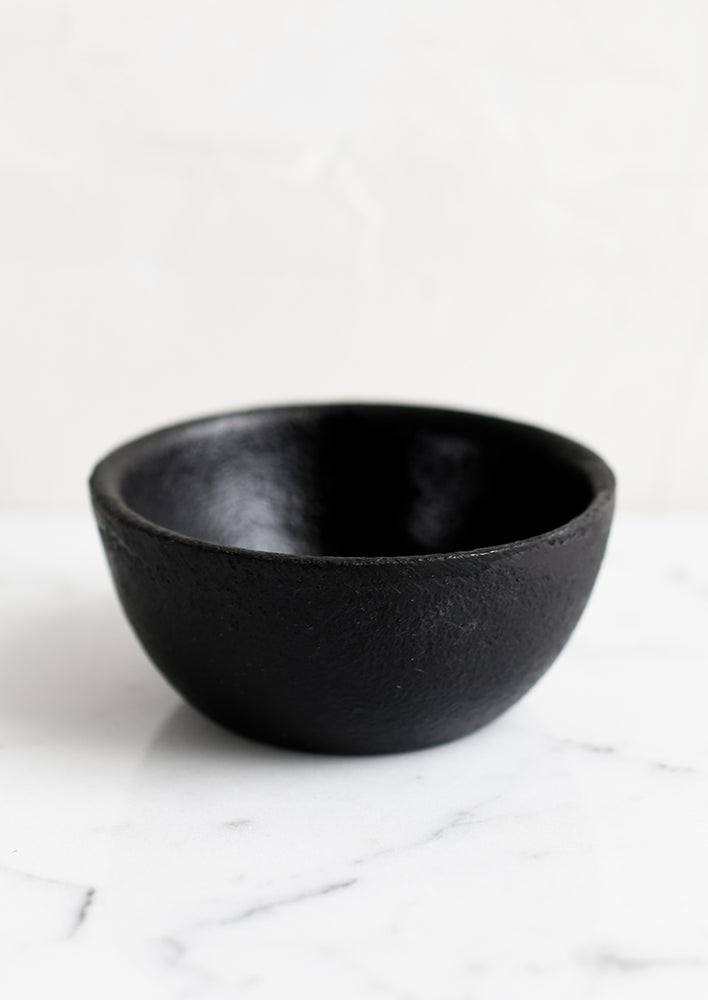 A small cast iron pinch bowl.