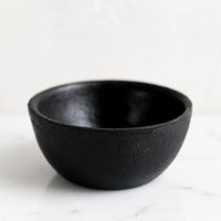 2: A small cast iron pinch bowl.