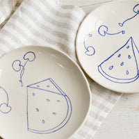 Side Plate: Two ceramic side plates with still life fruit drawings in blue.