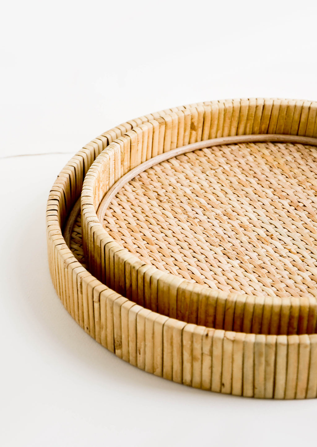 3: Nesting circular serving trays made from woven rattan