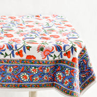 2: A colorful Indian floral block print tablecloth on a table.