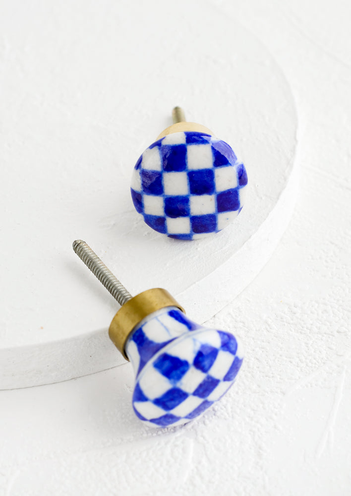 Round ceramic cabinet knobs with blue and white checkered pattern