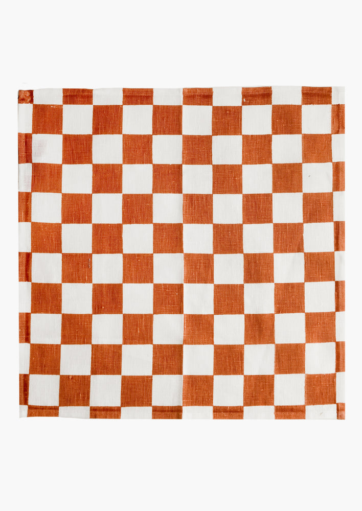 Terracotta: A checkered linen napkin in terracotta and white.