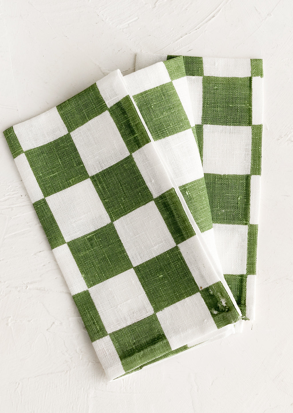Grass Green: A checkered linen napkin in green and white.