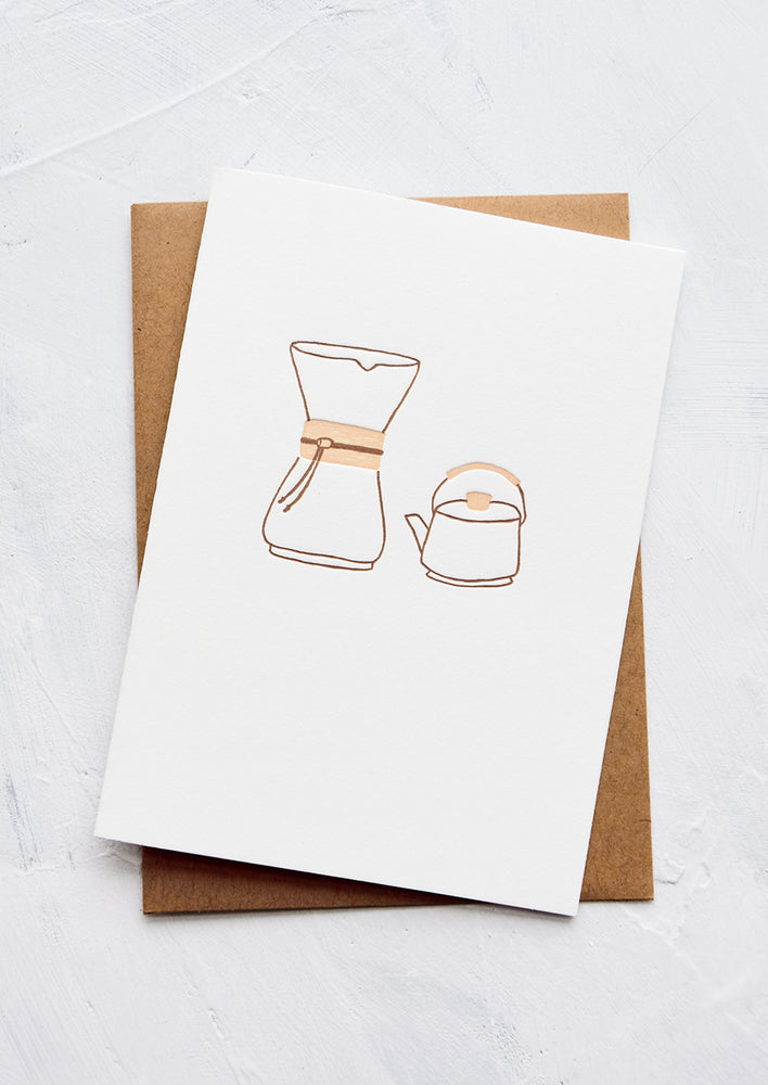 1: A letterpress printed greeting card with an image of a chemex coffee pourover and a kettle