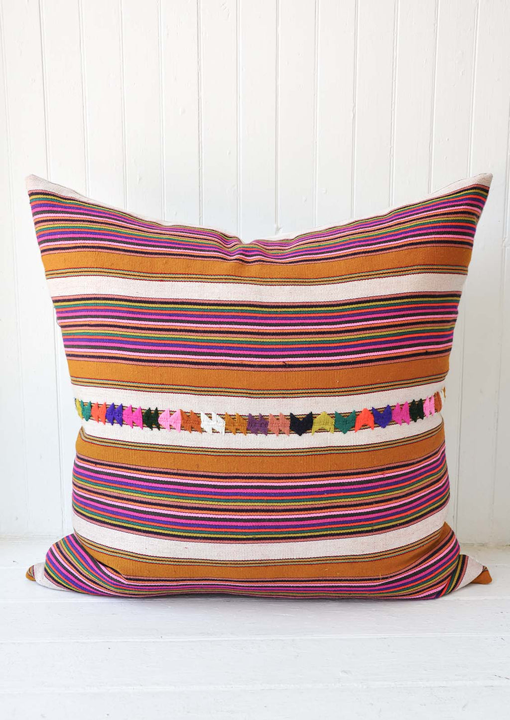 1: A multi-colored stripe pillow.