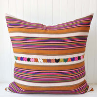 1: A multi-colored stripe pillow.
