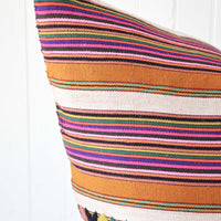 2: A multi-colored stripe pillow.