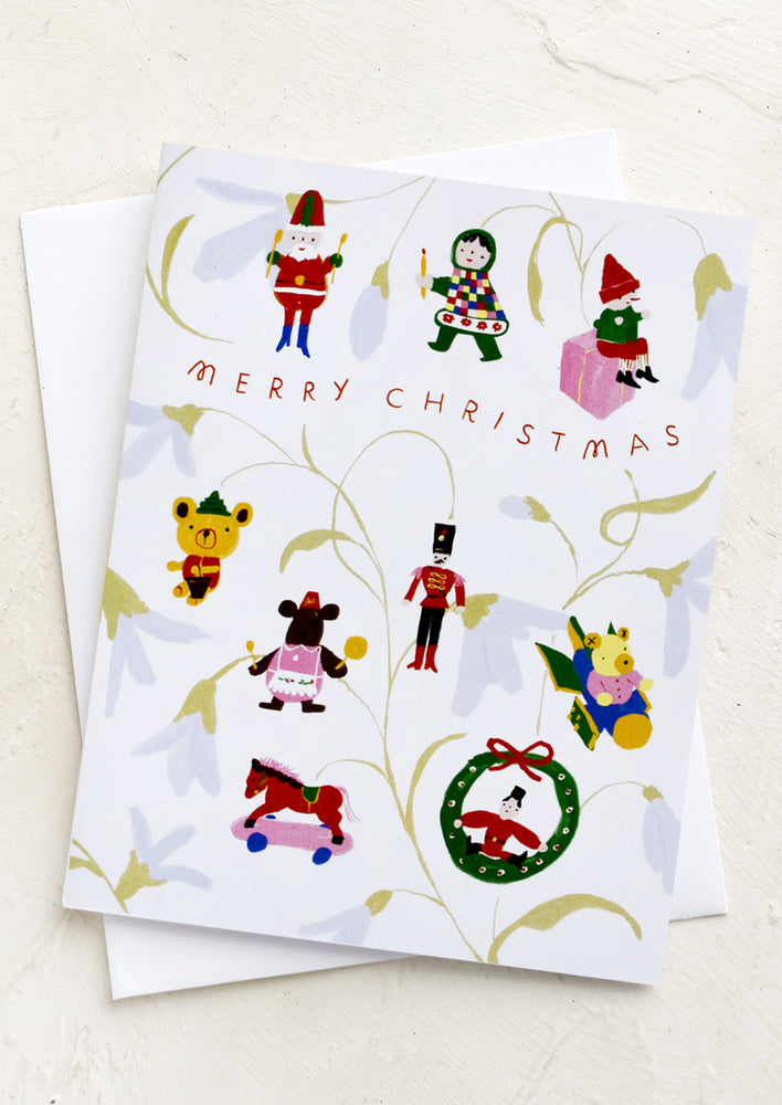 1: A card with Christmas ornaments hanging from branches, text reads "Merry Christmas".