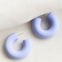 Winter Lilac: A pair of polymer clay hoop earrings in lavender.