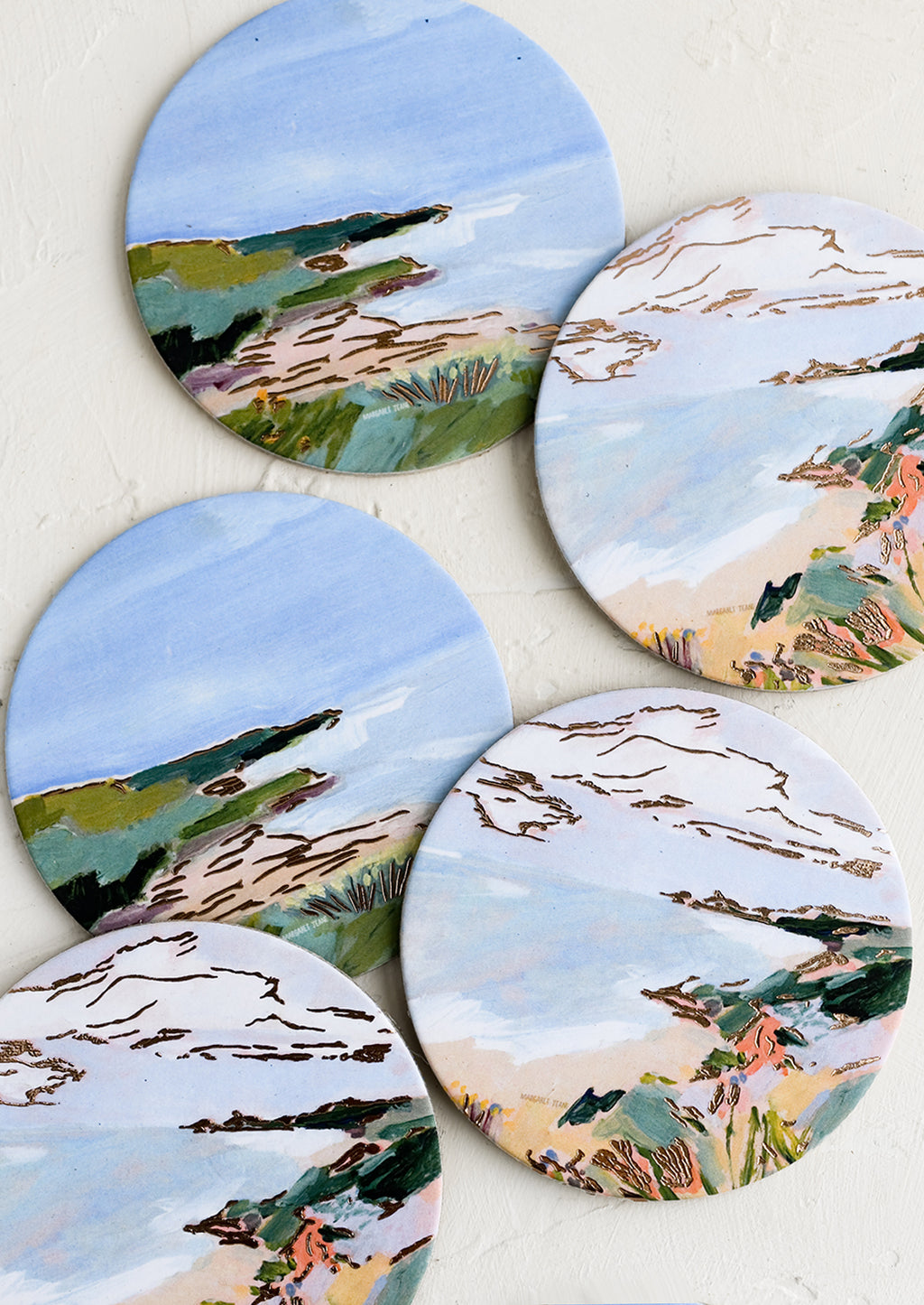Coastal Landscape: A set of six printed round coasters in coastal print.