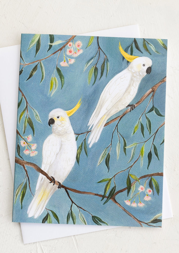 A greeting card with cockatoo illustration.