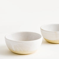 Warm White / Soup: Two white ceramic bowls.